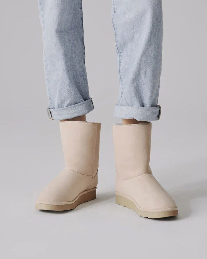 Ethical off-white mid-calf vegan boots with faux fur