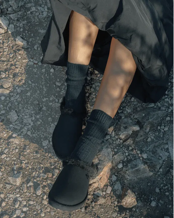 Black recycled ugg-like slippers sustainable warm footwear