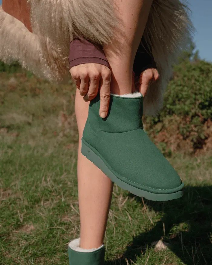 Ethical dark green vegan ankle boots with faux fur