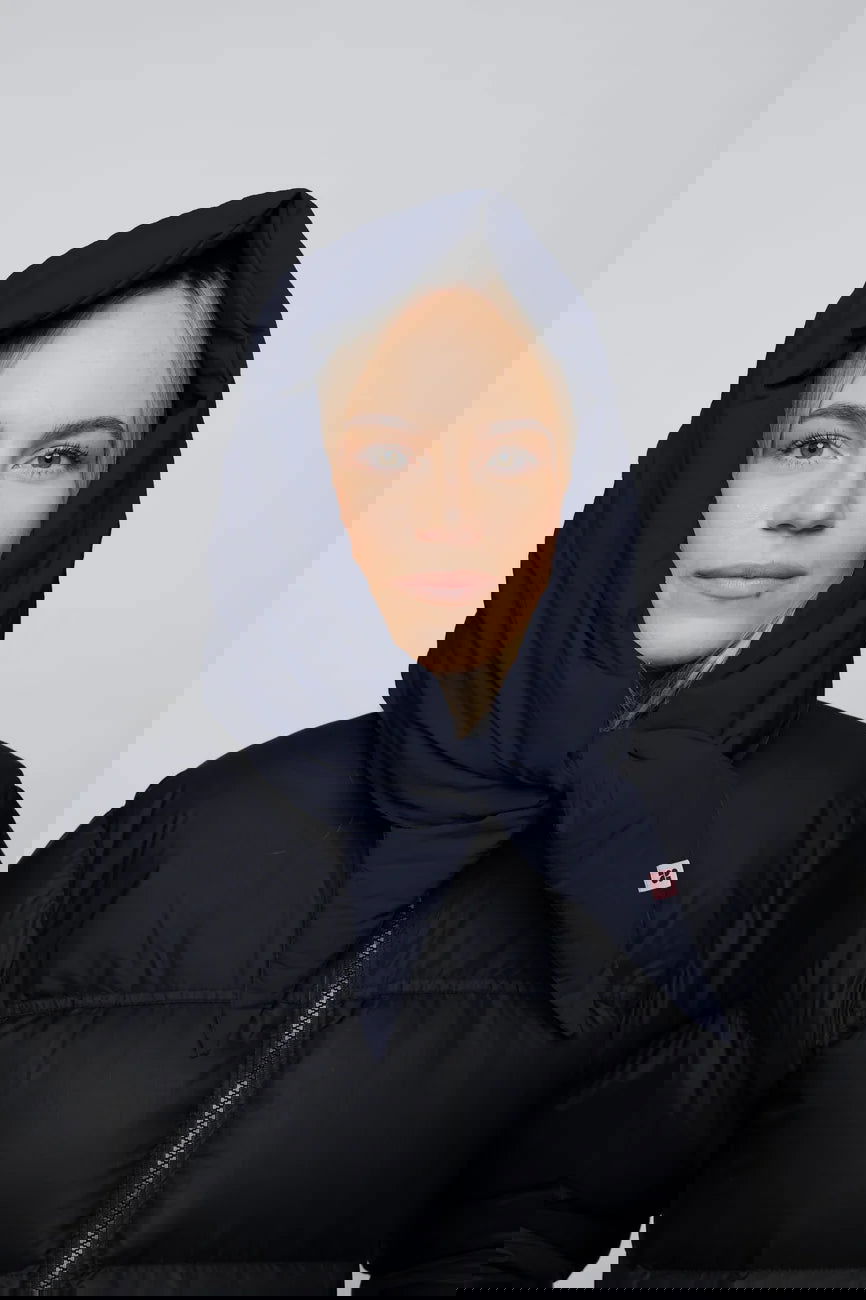 Winter Vegan Capuche Navy 1 Navy blue vegan winter capuche made from recycled materials, worn over black puffer jacket. - The New Orchard - Navy Blue