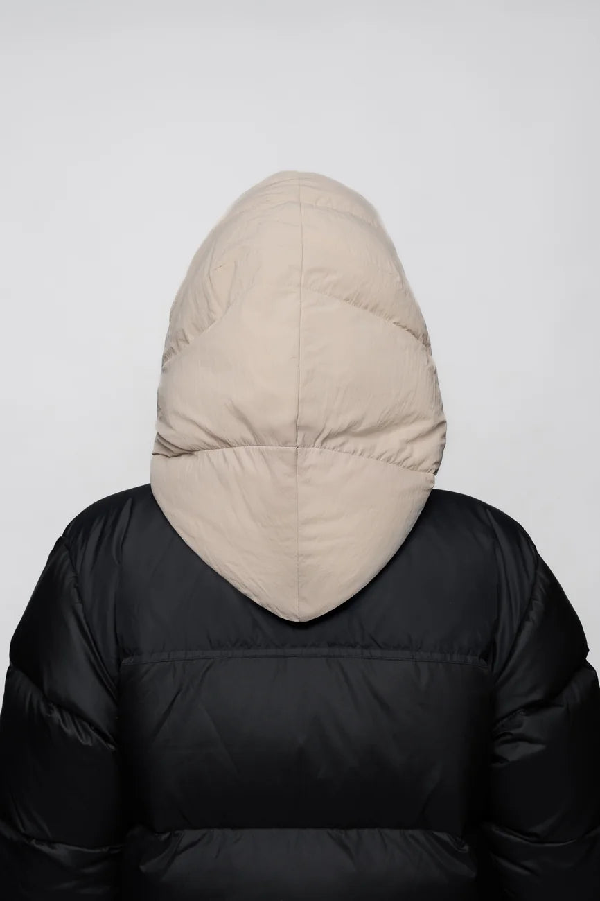 Winter Vegan Capuche Beige 5 Light beige vegan winter hood made from recycled materials on black puffer jacket from back view. - The New Orchard CH