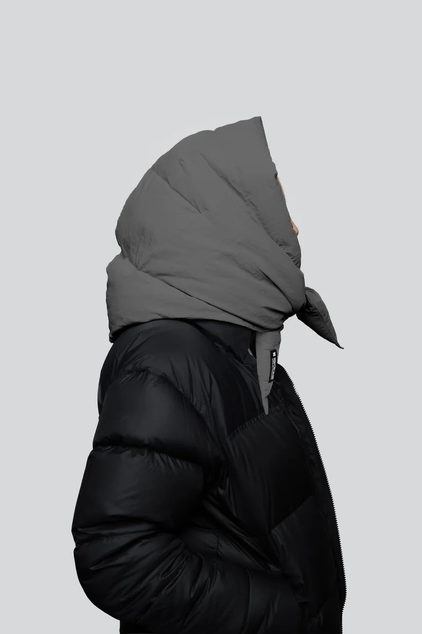 Winter Vegan Capuche Grey 3 Black vegan puffer jacket with recycled materials and oversized grey hood covering head. - The New Orchard CH