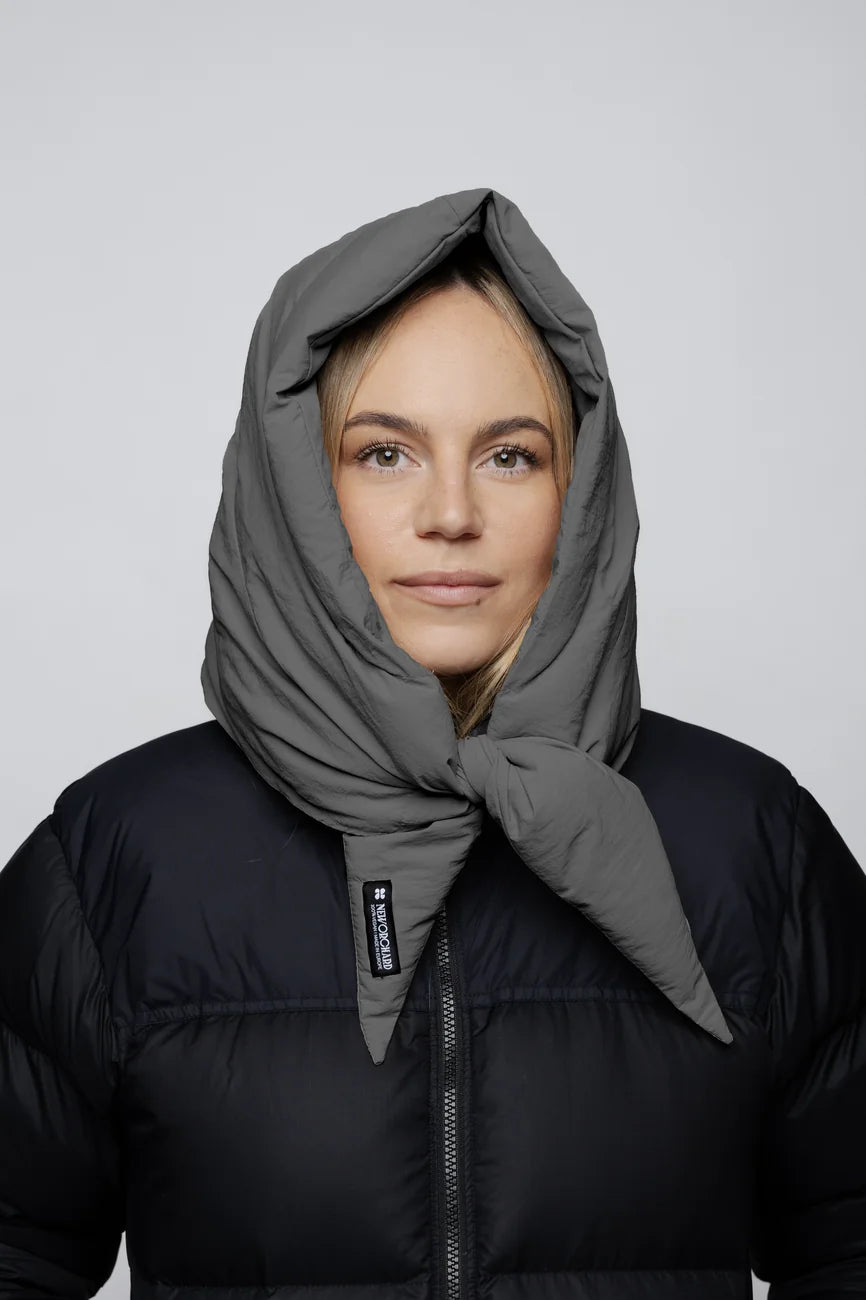 Winter Vegan Capuche Grey 6 Light grey vegan winter capuche made from recycled materials, worn over black puffer jacket. - The New Orchard CH