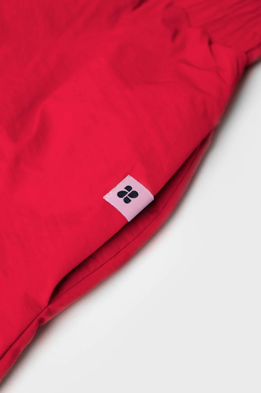 Winter Vegan Skirt Red (limited edition) 3 Vivid red vegan skirt made from recycled materials with small black logo tag. - The New Orchard CH