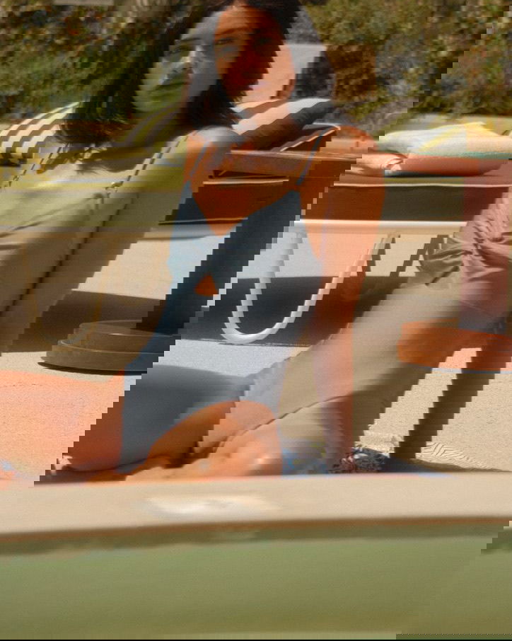 ALBA one-piece swimsuit in iconic blue with twisted neckline