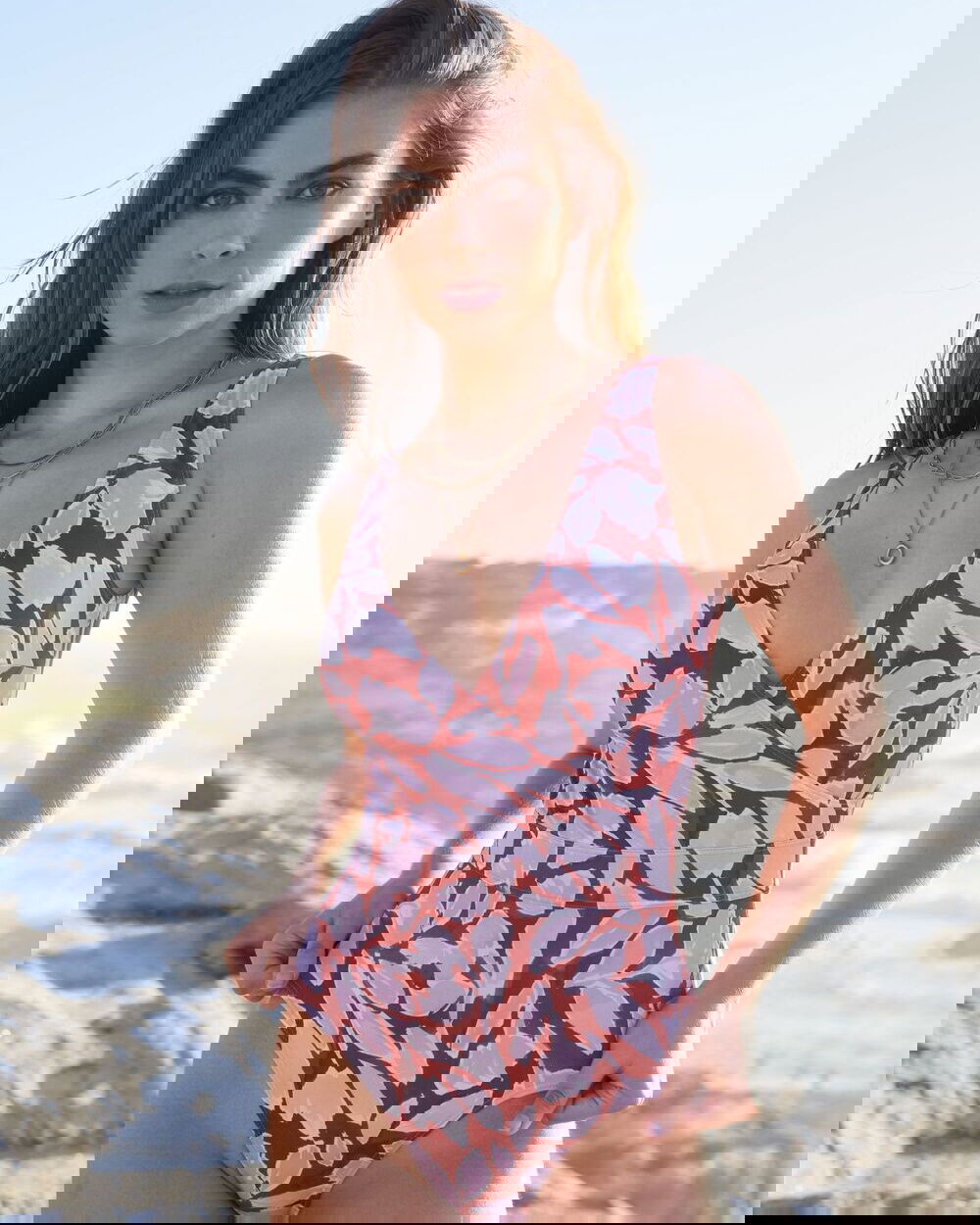 SPETSES one-piece swimsuit in Magnolia Red with wrap-front neckline and waist-belt effect