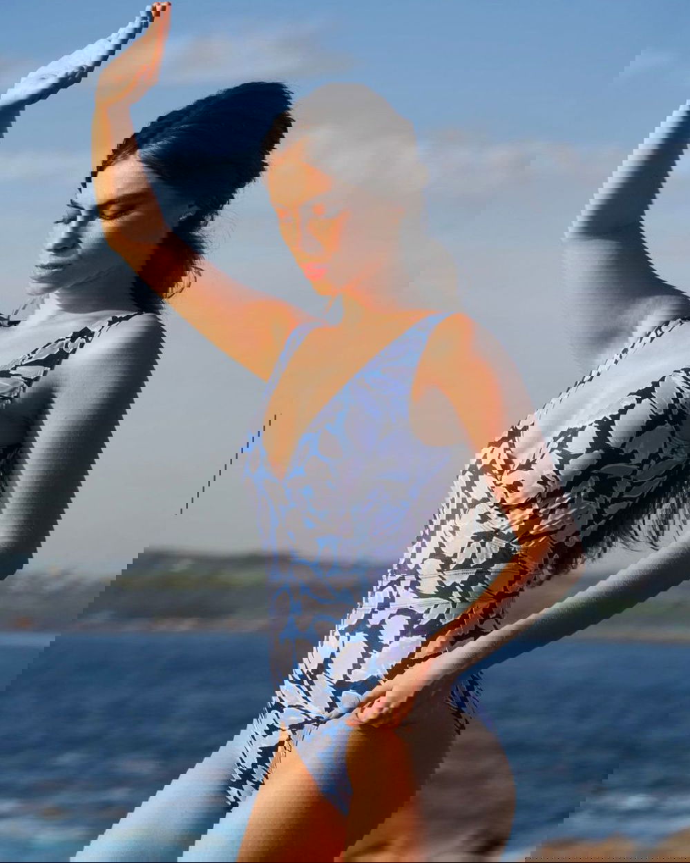 SPETSES one-piece swimsuit in Magnolia Blue with wrap-front neckline and waist-belt effect