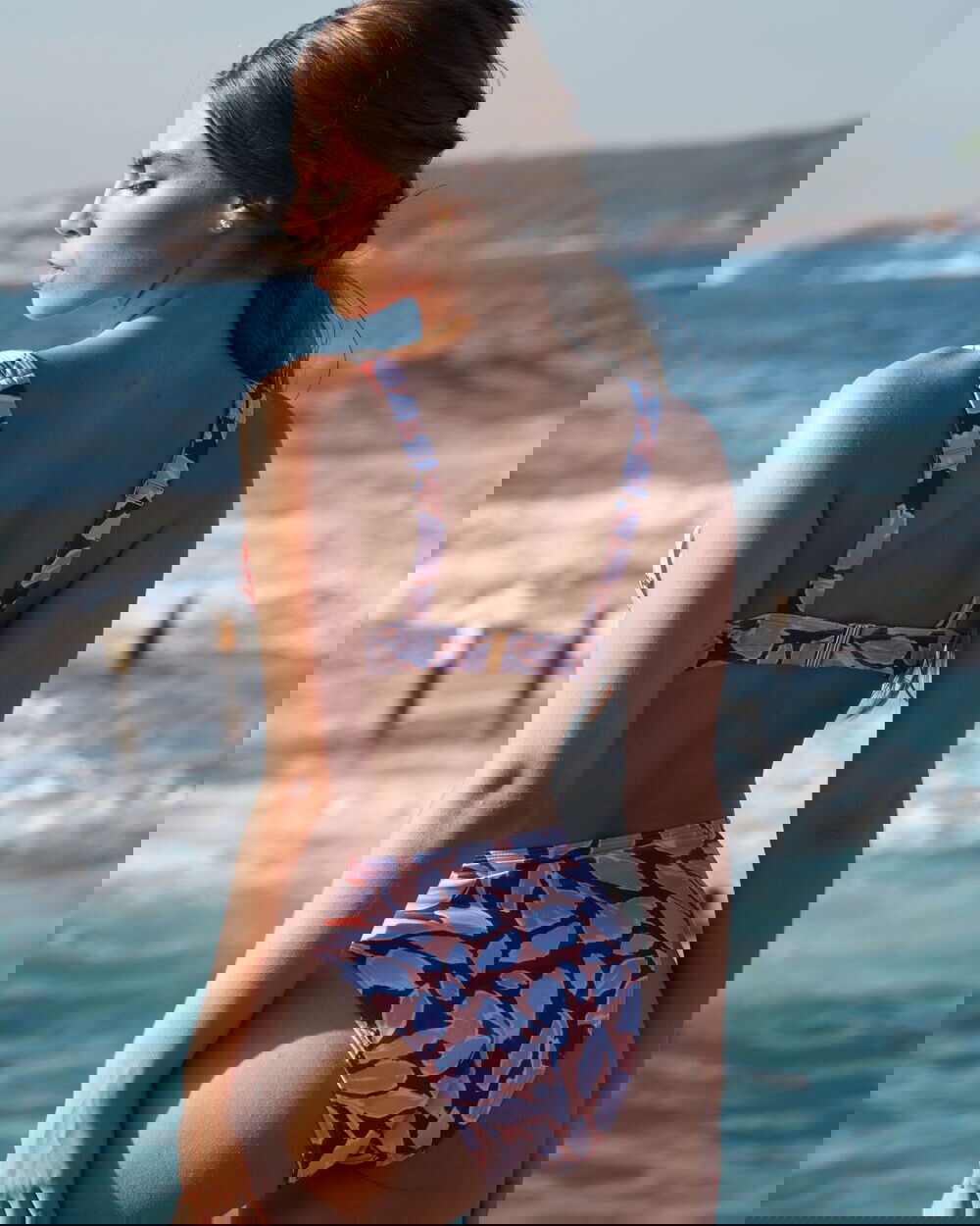 KEA mid-rise Brazilian bikini bottom in Magnolia Red, subtly high-cut leg